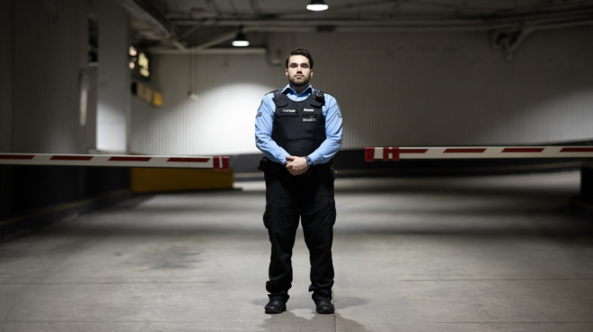 security guard in underground garage with full body armor