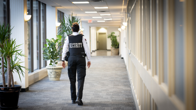 Security guard on patrol in a commercial building