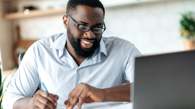 Professional male studying for ministry approved security gaurd exam