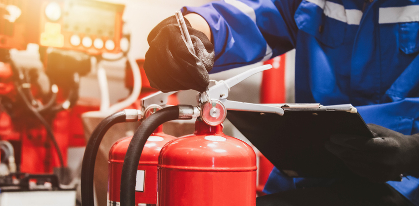 Engineer check fire suppression system,check fire extinguisher tank in the fire control room for safety